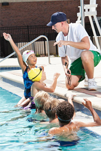 Summer camp counselor with campers